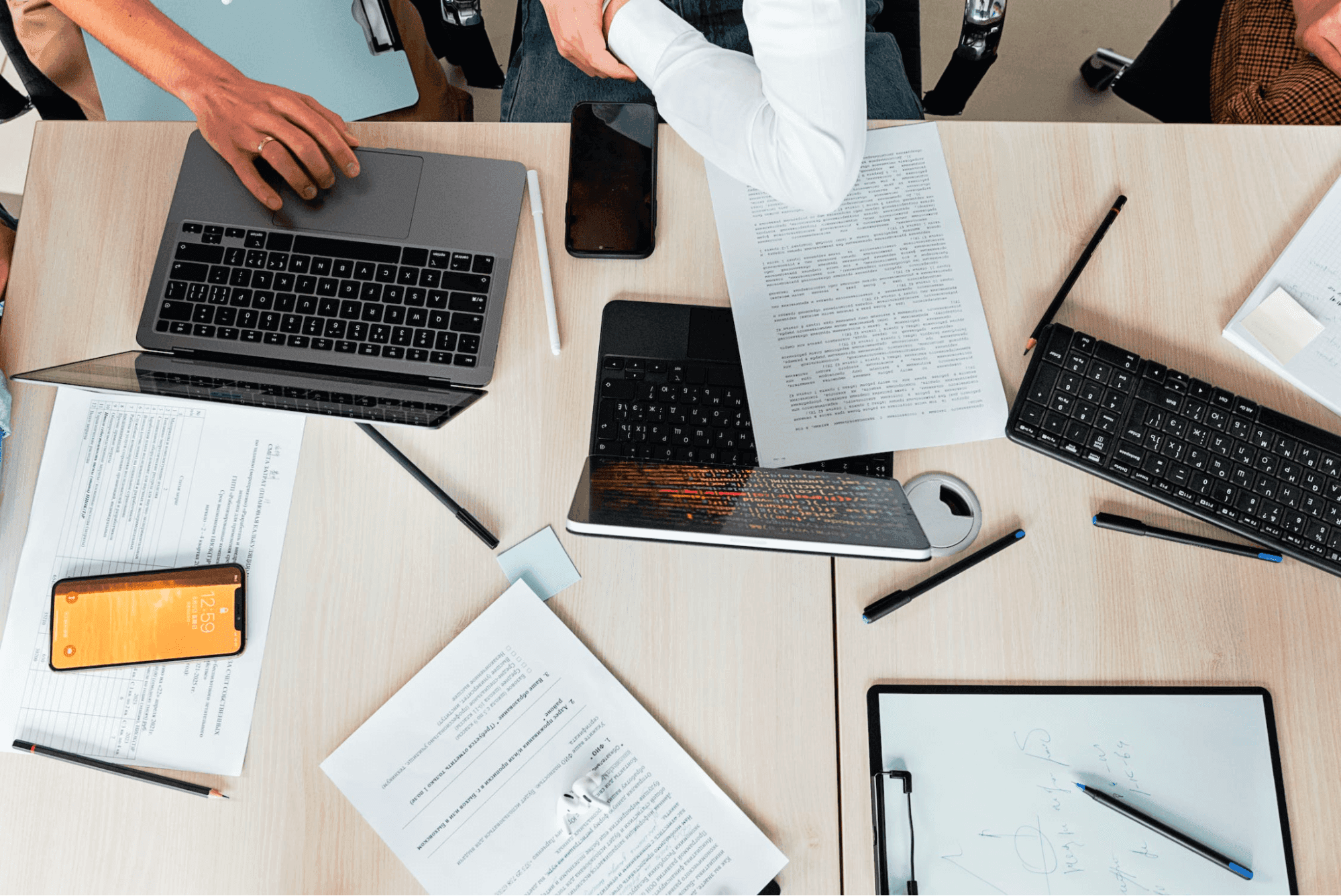 person using macbook pro on table
