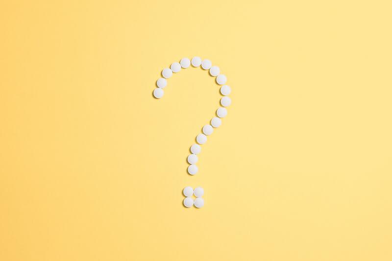 Canva White Beads on Question Mark Sign