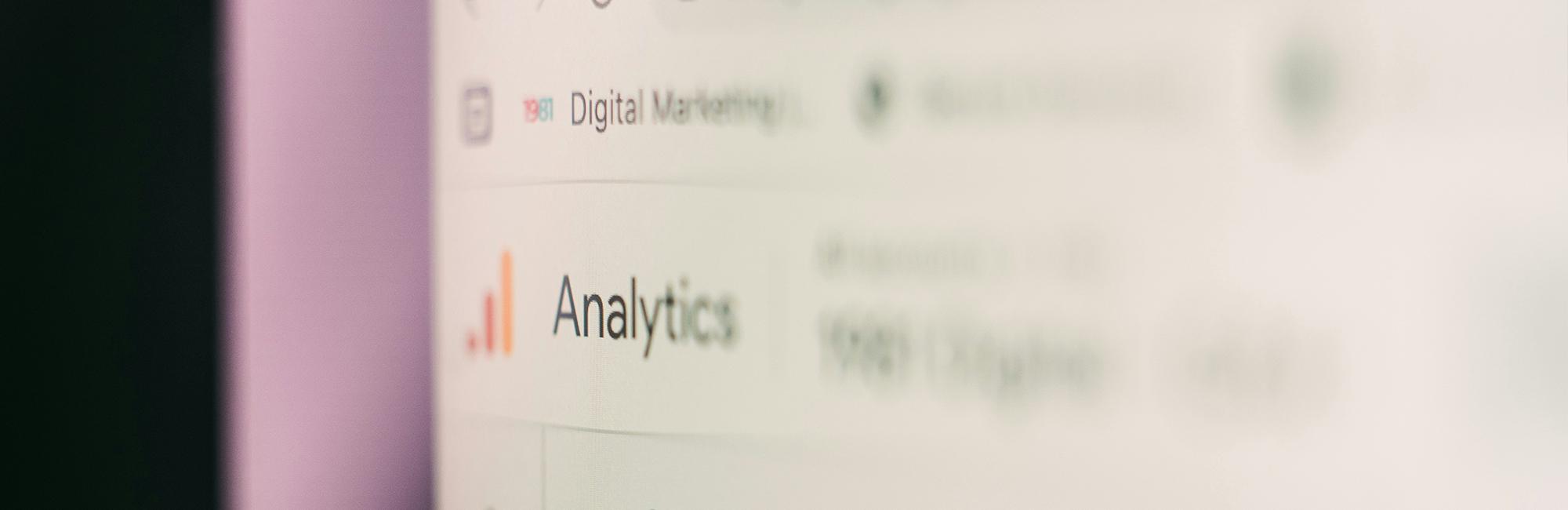 A close up photograph of a computer screen displaying performance marketing analytics.