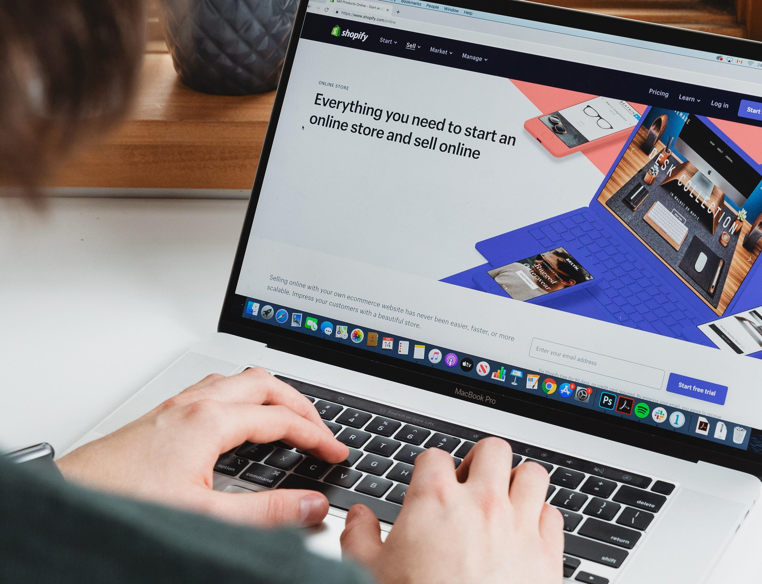 A laptop screen, displaying a page of the ecommerce site, Shopify